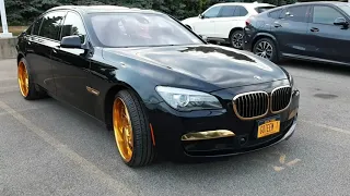 BMW 760 Li on gold wheels.