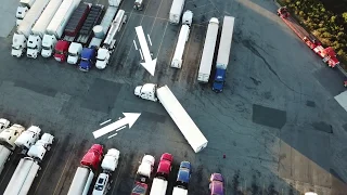 Truck Driving Student Backing At Truck Stop