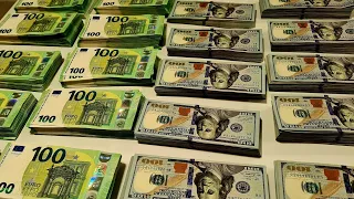 100,000 USD vs 100,000 EUR in cash.