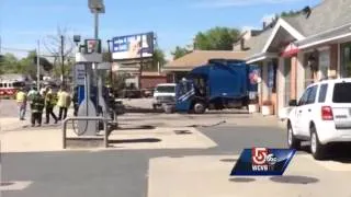 Downed wires trap driver in trash truck