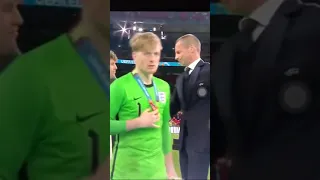England players taking of their silver medals immediately after receiving them