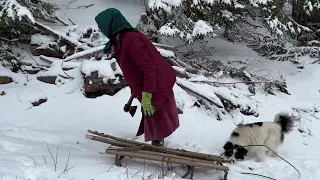 One day of rural life of grandma high in the mountains of Ukraine. Making threads from sheep's wool.