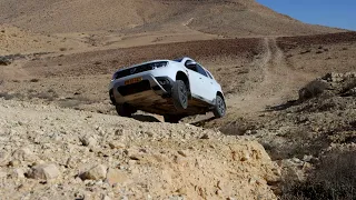 Dacia duster 1.3 with torsen rear diff lock tested off road crossing a deep ditch