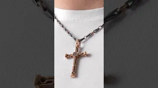 Rose gold cross with black diamonds. Black ceramic chain with rose gold.