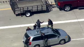 Police tackle suspect after chase on I-75 in Detroit