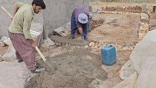 Stone work on the floor of Susan's house with the help of a master worker