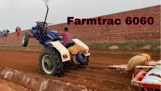 Farmtrac 6060 Pulling 24 disc Harrow