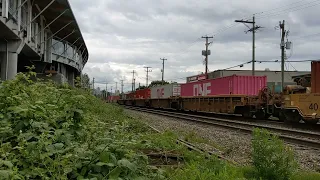 CN Rail SD70M-2s 8877, 8912 lead 37 well cars west at Mi153 New Westminster sub Vancouver BCJun10 22