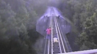 Women on Train Tracks Narrowly Escape Getting Hit