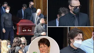 Mark and Donnie Wahlberg carry their late mom Alma’s casket during her funeral church service in Bos