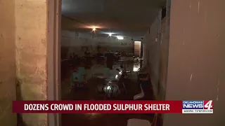 Dozens crowd in flooded sulphur shelter