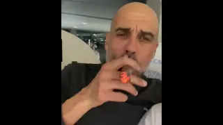 Pep smokes cigar singing Don't Look Back in Anger at City party