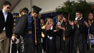 Paralyzed student, Austin Whitney, walks at graduation