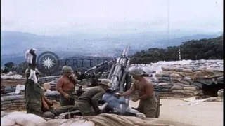 Soldiers loading 105mm Howitzers and CH-47 coming with the hanging supplies durin...HD Stock Footage