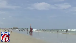 Lifeguards rescue dozens as rip currents plague crowded beaches