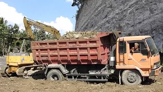 Excavator Dump Truck And Dozer Working Hard