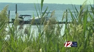 Man found dead in boat; two men charged with murder