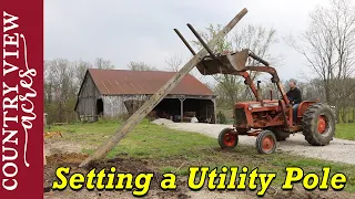 Setting a Utility Pole with a Tractor