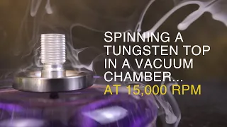 Spinning a Tungsten Top in a Vacuum Chamber