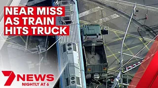 Train ploughs straight through truck in south east Melbourne | 7NEWS