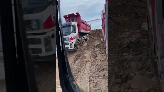 Volvo Fm12 struggling to get out from mud