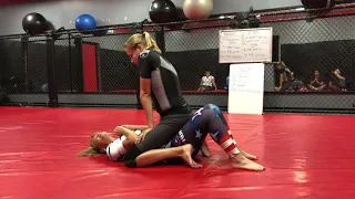 AJ Clingerman teaching a Women's Class at IBJJA how to use the Upa for Mount Escape in Jiu Jitsu