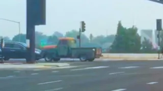 Backwards Truck Driving Down The Road