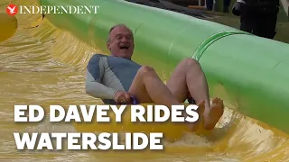 Ed Davey rides waterslide as Lib Dems continue election campaign