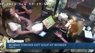 Woman throws hot soup at worker