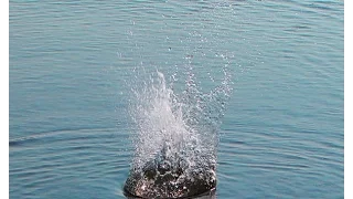 throwing a big stone in to the water in SlowMotion