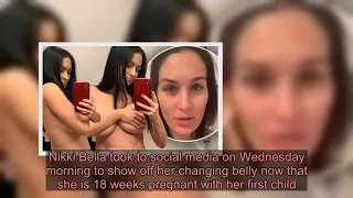 Nikki Bella shows off her ABS while 18 weeks pregnant as she comments on her chest in shirtless phot