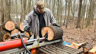 Zach uses Huskee 35 ton log splitter to split and stack oak firewood blocks