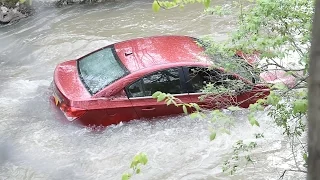 Car stuck in Onondaga Creek in Syracuse, NY (video)