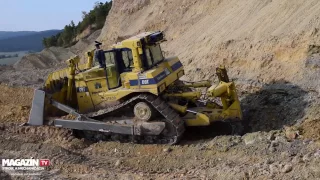 Dozer Caterpillar  CAT D9T pushing dirt down to quarry