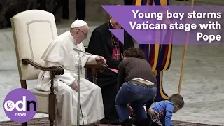 Young boy storms Vatican stage winning over the Pope