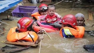 Devastating monsoon rain in Indonesia causing buildings to collapse