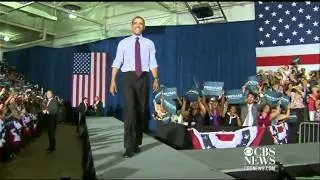 Obama trips on stage