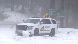 Cars slipping, sliding and crashing in heavy snow in Big Bear Lake , CA