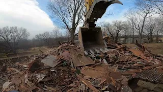 House demo Loading the dumpster