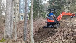 Using my 52" rake and dozer blade with my mini excavator to build a trail access from above