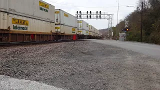 Engineer gives shave and a haircut as impatient driver makes a U turn close to the tracks.