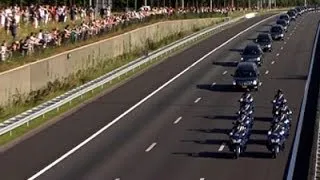 Raw: Mourners Gather As MH17 Bodies Transported