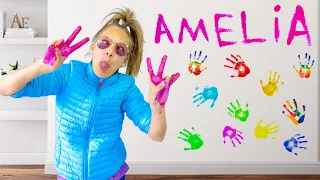 Amelia and Avelina learn how to paint with colors