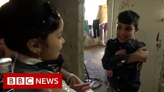 Two children, a decade of war in Syria - BBC News
