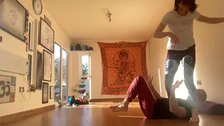 Backward roll over legs to stand!