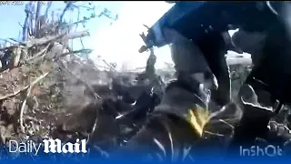Ukrainian soldiers use grenades and sub-machine guns to clear Russian trenches near Novopokrovka