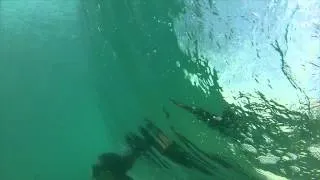 Suzy going under a wave at Point Dume GoPro HD