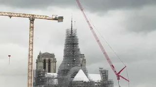 Reconstructed Notre Dame Cathedral spire revealed in Paris after devastating 2019 fire