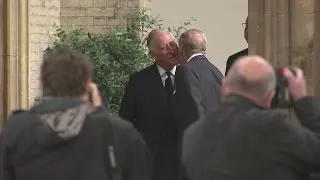 Prince Charles comforts the Queen with a kiss at funeral of Countess Mountbatten of Burma