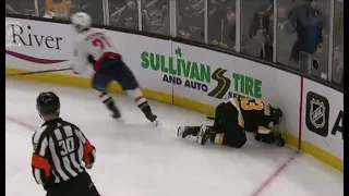 Hathaway throws a hit on Brad Marchand